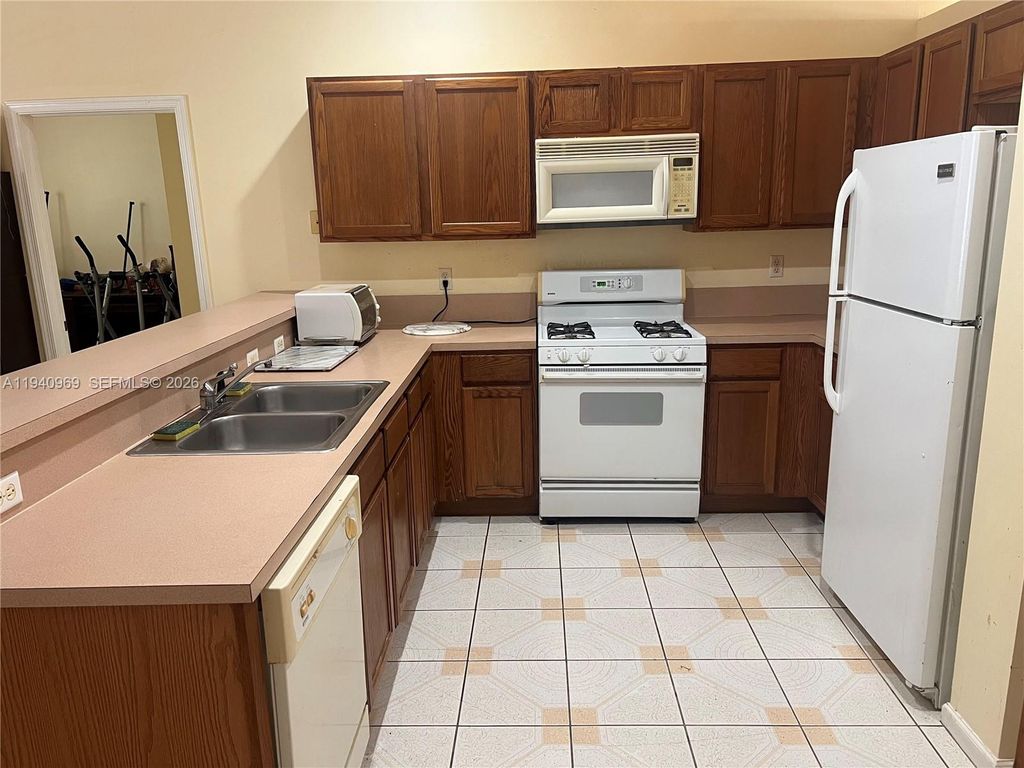 Photo of 1327 Monteray Way, Green Acres, FL 33413 (MLS # A11940969)