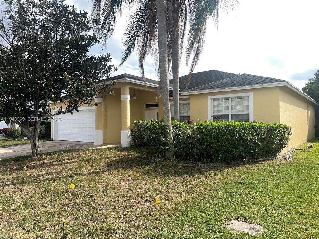 Photo of 1327 Monteray Way, Green Acres, FL 33413 (MLS # A11940969)