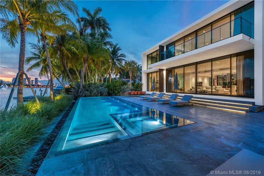 New Modern, Uniquely designed Elevated “Glass” house on gated and secured Hibiscus Island. Southern exposure, panoramic views of Biscayne Bay and Downtown. Private entry garden capturing sea breeze with an open floor plan with tall 20’ ceiling entry leading to glassed central courtyard, adding natural light and enhancing views. Spacious master suite, captivating scenes and oversized terrace. Rare separate guest house with full kitchen and 2 car garage. Custom furniture professionally decorated throughout. Sleek infinity edge pool with concealed equipment, outdoor kitchen and custom outdoor seating. Elevator leading to private rooftop terrace. Island amenities include tennis, basketball, playground, newly paved streets, new utilities, new landscaping and police protection.