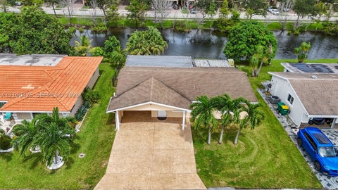 Photo of 4711 NW 58th St, Tamarac, FL 33319 (MLS # A12100425)