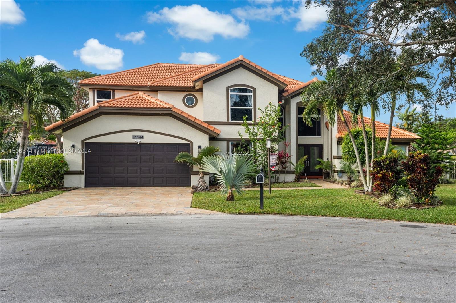 Upgraded & Spacious 4 Bed, 3 Bath Lakefront Home in Coral Spring's convenient Carriage Pointe Estates. With one of the largest lots in this guard-gated community, you'll enjoy outdoor life with beautiful long lake views, a large fenced yard with pool, fire pit, outdoor serving bar, 2 pergolas and plenty of space for outdoor playtime.  Inside you'll appreciate the comforts and security of a newer impact windows and doors, rich look bamboo floors, Stainless Steel appliances including Smart Fridge, Smart Thermostat, and a smartly designed first floor primary suite with large bathroom, quite ample closets, and  calm aura. With a bright yet large laundry/utility room, even work can be a pleasure.  Two car garage, long flagstone drive, & cul-de-sac, there's room for guests to join in the fun.