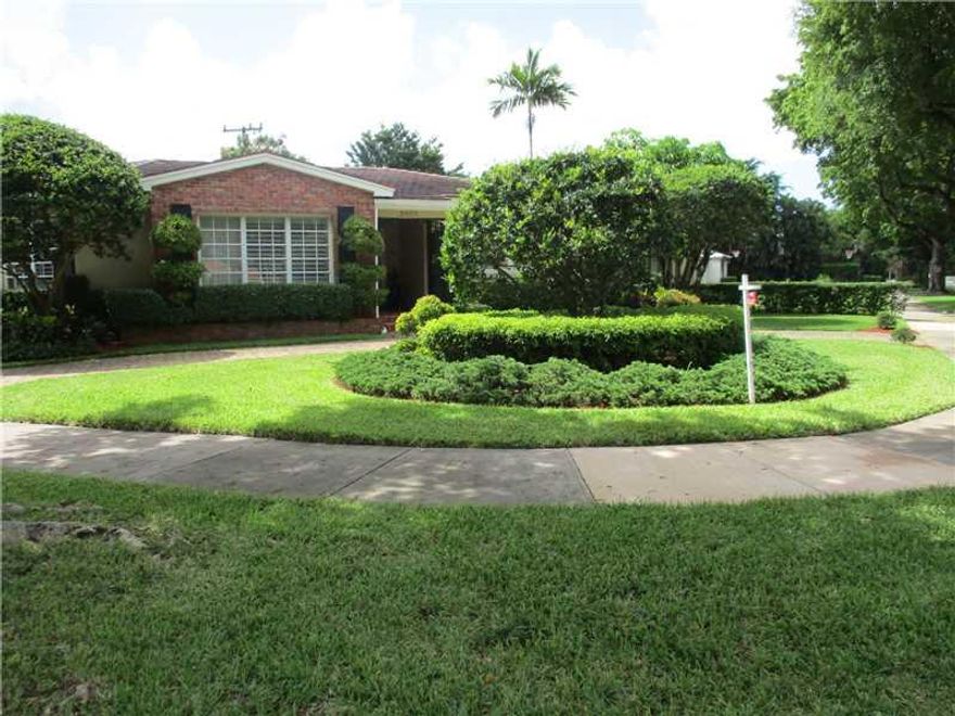 Desirable Golden Triangle area near Venetian Pool, Youth Center, Library & Miracle Mile. Charming 4/2/ 2 car garage home designed by architect H.George Fink. Home features; foyer entrance, hdwood floors, split bedrm plan, open/spacious formal liv & din ro oms + family rm & eat-in kitchen. Lovely private backyard patio w/vine covered pergola for entertaining. No room for a pool. Covered front entrance & great curb appeal with lush landscaping on corner lot. Chicago brick circular driveway. A turn key!