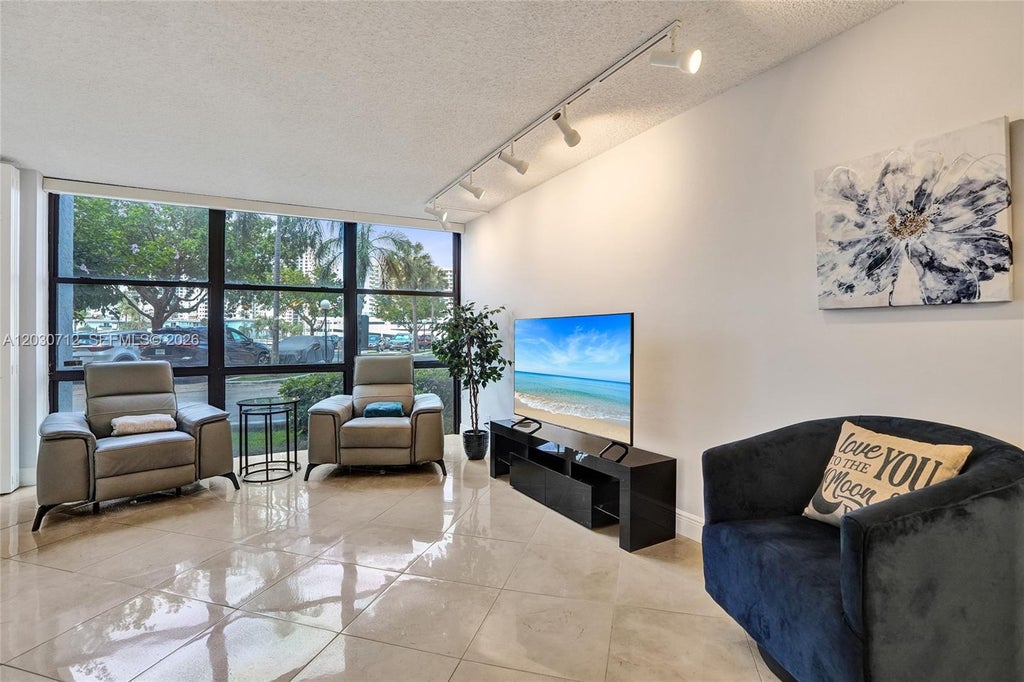 Photo of 1000 Parkview Dr #104, Hallandale Beach, FL 33009 (MLS # A12030712)