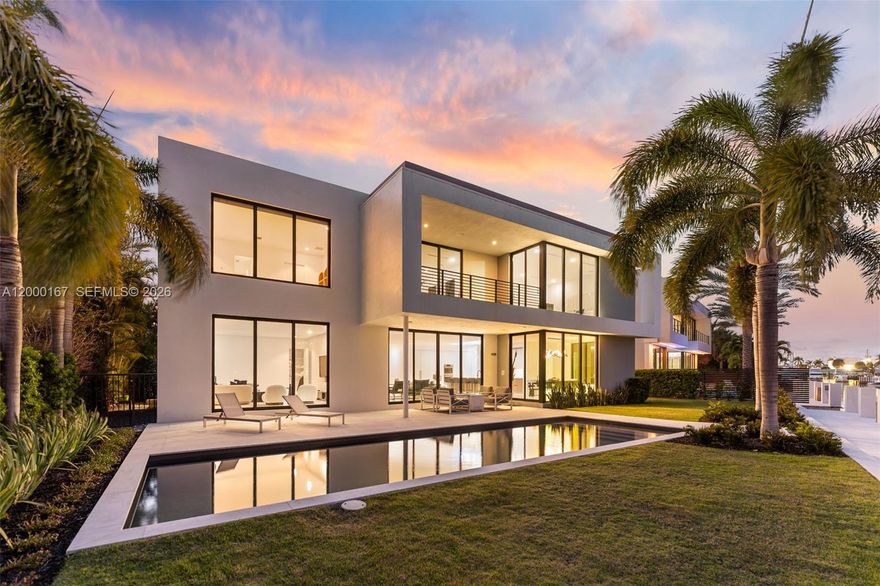 Welcome to Casa Aqua, Where Modern Design Meets the Open Sea, an architecturally award-winning waterfront estate offering the pinnacle of South Florida luxury living. Built in 2020, this stunning modern residence spans approximately 5,484 sq ft of impeccably designed interior living across two stories, complete with a private elevator and 3 car garage.
Positioned on 100 feet of deep-water frontage with direct canal access and no fixed bridges to the ocean, this is a true boater's paradise, docking vessels up to 80 feet with effortless access to the open sea. Minutes to Hillsboro Inlet.

Walls of glass and soaring ceilings flood the interiors with natural light, while the open-concept layout is anchored by a chef's kitchen with premium Thermador and Bosch appliances. The residence features 5 spacious en-suite bedrooms including a private primary suite, 6 bathrooms, a loft and club room, designer smart LED lighting with Bluetooth in-wall sound system, and a private heated saltwater pool surrounded by natural stone hardscape and premium landscaping.
Over $500,000 in recent enhancements elevate this estate beyond compare, including a new concrete dock with upgraded pilings, custom fireplace, illuminated baseboard fire riglet feature, and a curated exterior featured in Modern Home magazine.
Located moments from the beach, dining, boutique shopping, and FLL airport. Casa Aqua is even better in person! Schedule private tour today!