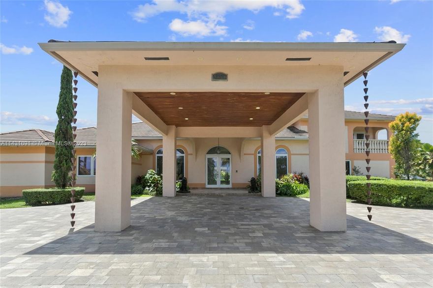 A spacious and updated pool home in over an acre of pristine land with outstanding landscaping, fruit trees and much more awaits you in this elegant home close to everything but yet very private.  Gated electric entry, new impact windows and doors, new roof, porte cochere are just the beginning.  Home has a full separate in-law quarter with 2 bedrooms, 1 bathroom, living and dining rooms as well.  Main home boasts 5 big bedrooms (multiple with in suite bathrooms) 5 full bathrooms, living room, dining room, family room, game room.  Full outdoor kitchen.  Everything that you would want and more.  Don't hesitate, this is the least expensive home on the market in the area by far especially when you consider everything that this home has to offer. Don't miss this entertainer's dream house.