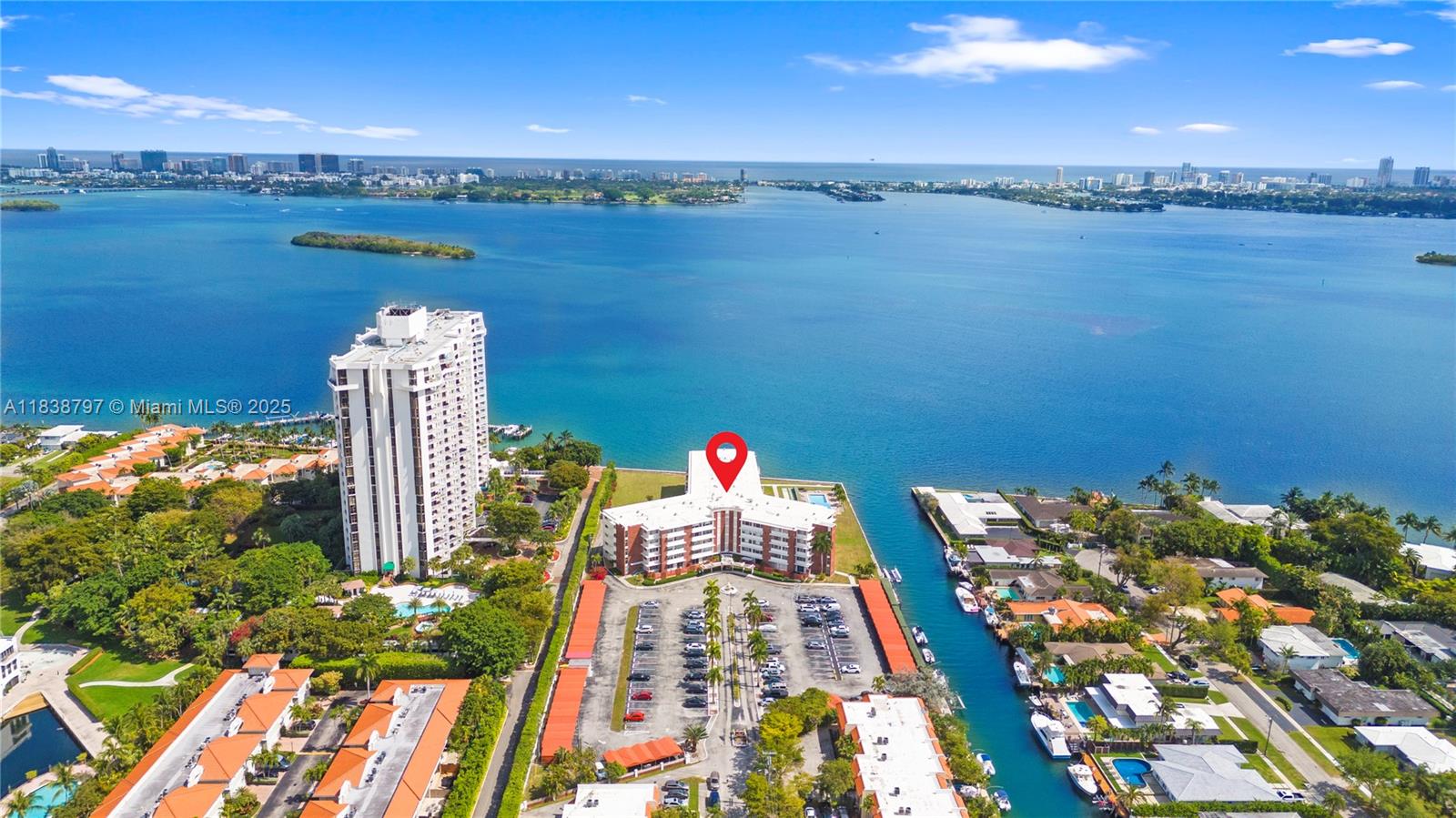 Experience bayfront living at its finest in this spacious, light-filled unit with stunning canal views. Featuring an updated kitchen with stainless steel appliances, updated bathrooms, oversized walk-in closets, and impact windows throughout, this turnkey home offers both style and functionality. Enjoy a pool deck overlooking Biscayne Bay, assigned parking, private storage, and a fully reserved building. The 40-Year Certification is complete, with recent upgrades including a new seawall, roof, and secure lobby. Located on a peaceful cul-de-sac just minutes from Miami Shores Country Club, Bal Harbour, and Miami Beach. Boater-friendly and beautifully maintained—this is a rare opportunity to own a waterfront gem in one of Miami’s most desirable areas. Easy to show!