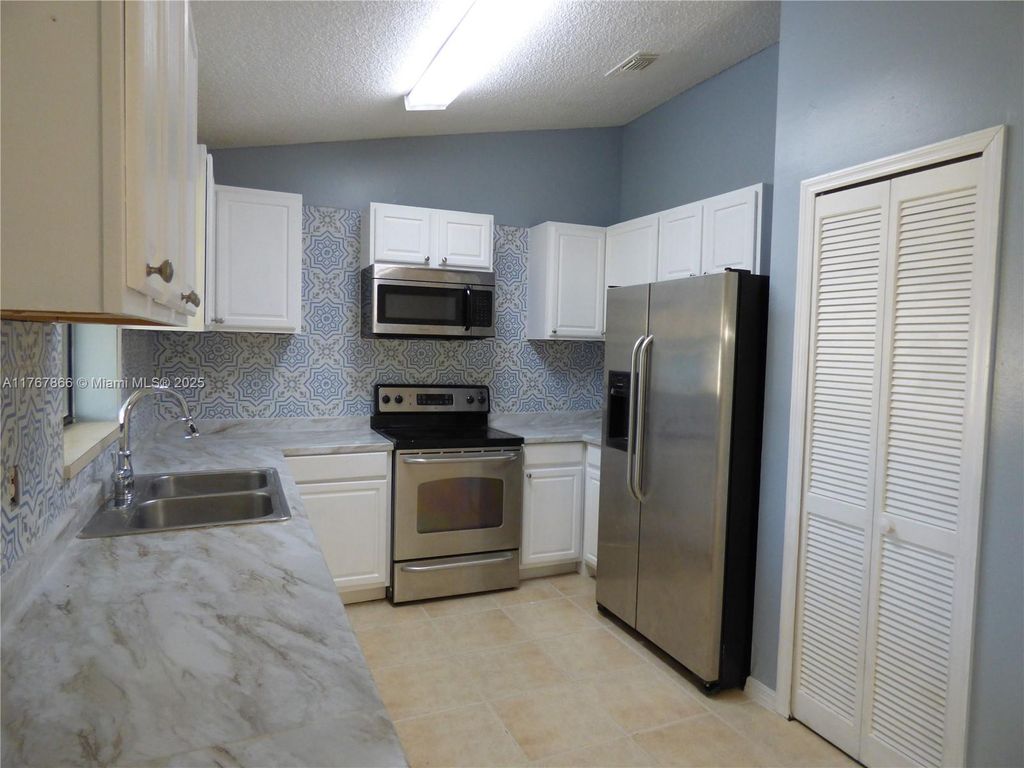 Photo of 5629 NW Commodore Ter, Port Saint Lucie, FL 34983 (MLS # A11767866)