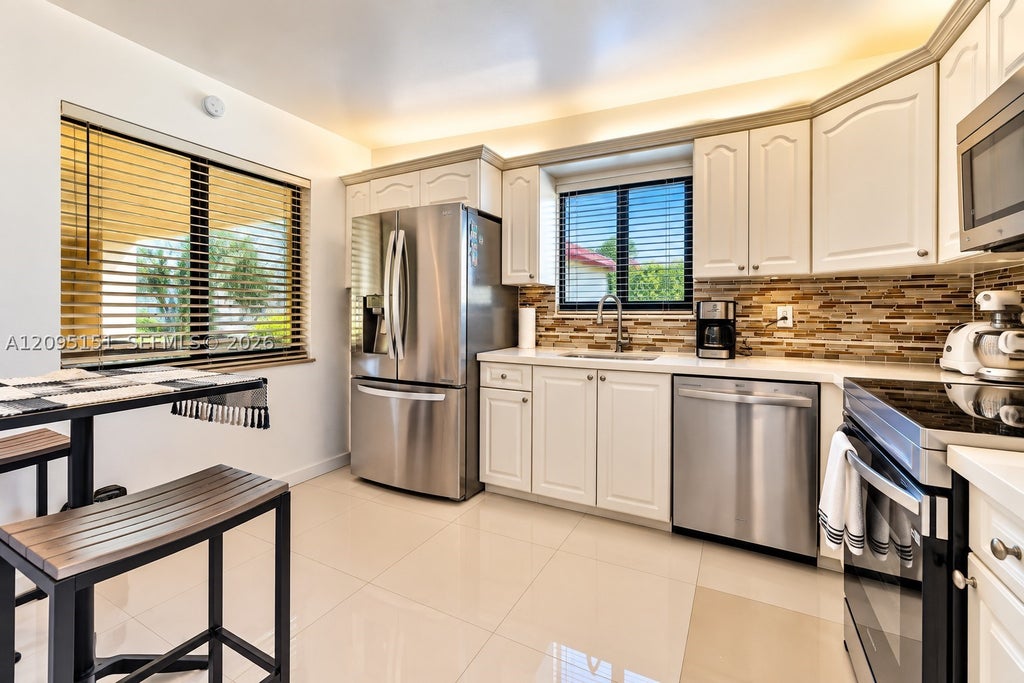 Photo of 16273 Laurel Dr #7, Weston, FL 33326 (MLS # A12095151)