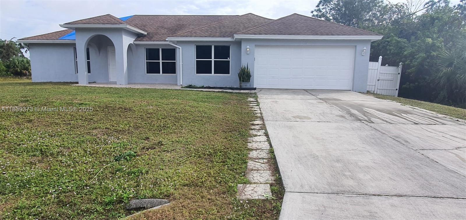 Spacious 4/2 Home on Corner Lot – Available Now in Lehigh Acres! This move-in ready 4-bedroom, 2-bath home sits on a generous corner lot, offering plenty of space and easy parking for multiple vehicles. The home features tile flooring throughout, a fresh coat of paint, and a bright, open layout perfect for families or roommates. The oversized yard is ideal for relaxing, playing, or entertaining. Located in a quiet residential area with quick access to schools, shopping, and major roads. Only first month & security deposit required – no hidden fees! Open to negotiation for strong applicants. ??Don’t miss out—homes like this go fast!