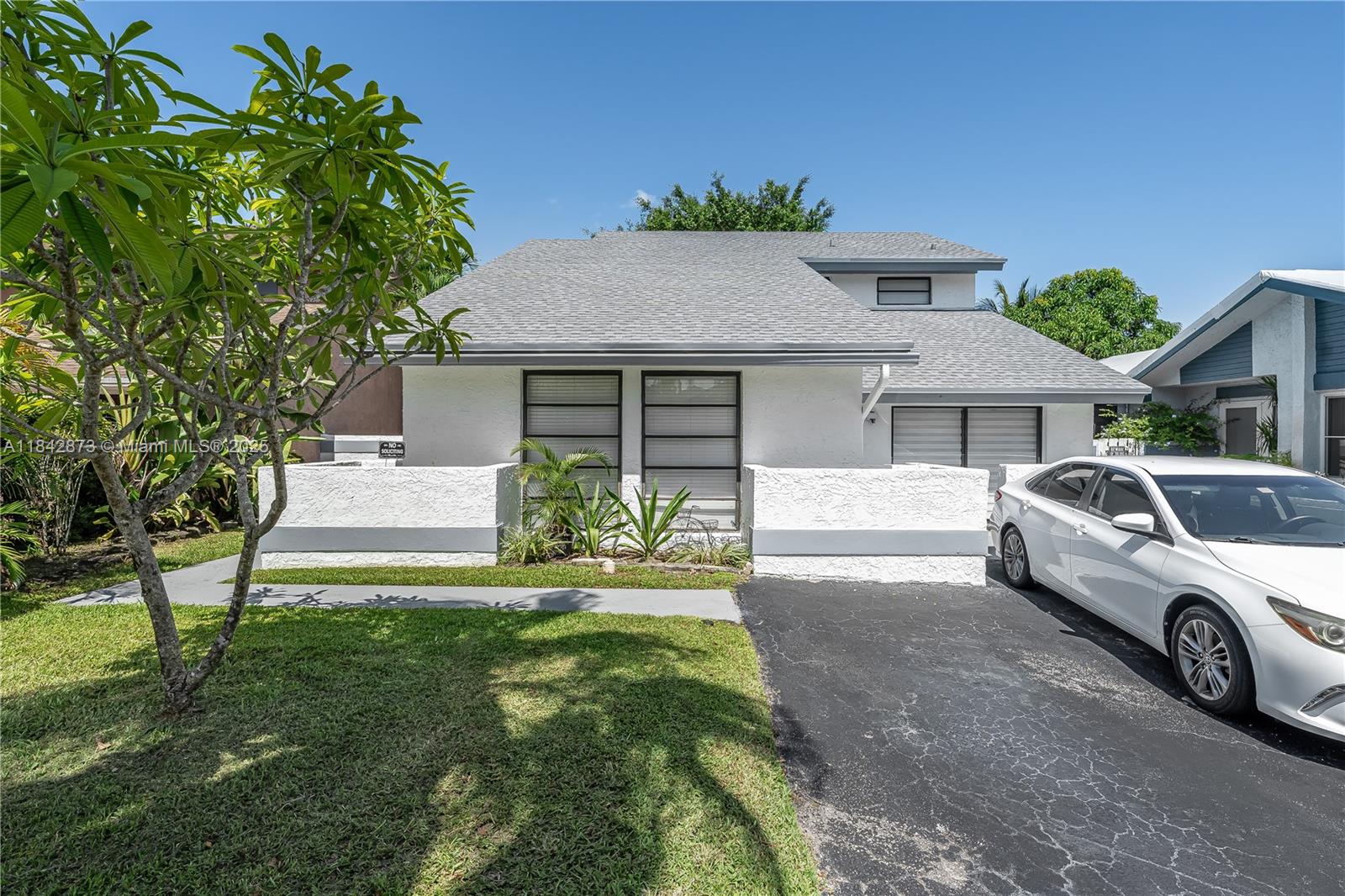 OPPORTUNITY KNOCKS! This is your chance to own a HUGE home with flexible living spaces for only $625,000. This is a 3 bedroom with a downstairs addtional room that can be used as 4th bedroom or office. Large bedrooms. Light & bright with soaring ceilings & windows galore. Living room/dining room AND another additional space that can be used for play or recreation area. ALL the big ticket items are done! Roof is 2 years, AC 4 years, new appliances & 2 year old washer/dryer. BIG covered patio with large shaded fenced yard all overlooking the wide canal. Exterior is freshly painted. Quaint little Davie community with BEST schools & low HOA. Centrally located with easy access to schools, highways, shopping, airport & popular Bamford park (sports, tennis & aquatics) Walk to Reflections Park!