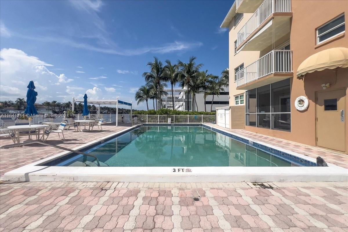 Welcome to your coastal oasis! This charming 1-bedroom, 1-bath condo blends comfort and convenience, just steps from the beach. The spacious living room is bathed in natural light, with sliding doors opening to a lovely balcony and views of boats gliding by the Intracoastal. The inviting interior features stylish tile flooring, custom mirrors, and elegant wooden cabinets. Enjoy exclusive amenities, including a refreshing pool, in a building with a brand-new roof and no assessments. Ideally located between Fort Lauderdale and Miami, with shopping, dining, parks, and nightlife minutes away. Rentals are not allowed, making this a perfect personal retreat. Don’t miss this chance to embrace the beachside lifestyle!