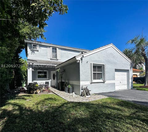 Photo of 1955 NW 184th Way, Pembroke Pines, FL 33029 (MLS # A12069725)