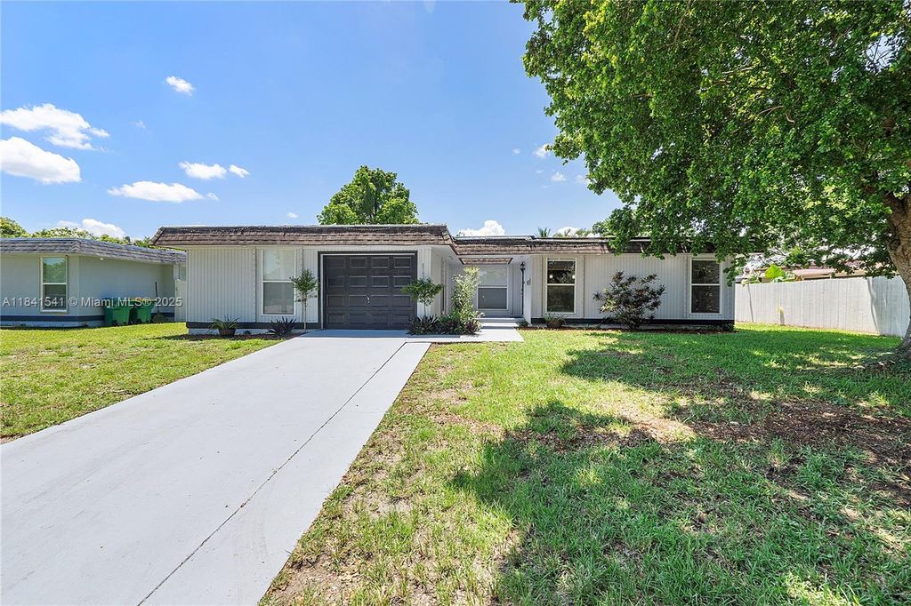 Photo of 6703 Brookwood Blvd, Tamarac, FL 33321 (MLS # A11841541)