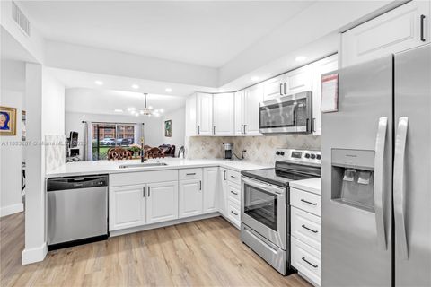 Photo of 701 SW 142nd Ave #108S, Pembroke Pines, FL 33027 (MLS # A11883267)