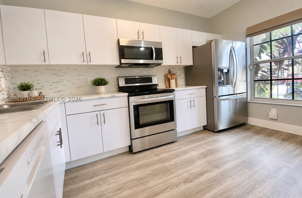 Photo of 340 SW 121st Ter #340, Pembroke Pines, FL 33025 (MLS # A12049769)
