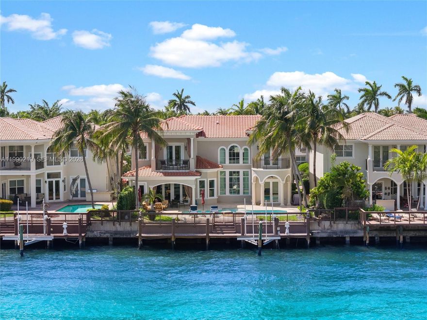 A commanding Intracoastal estate within the exclusive gates of Harbor Islands, where scale, setting, and waterfront presence come together in one of Broward’s most coveted communities. Positioned along 65 feet of canal frontage with direct Intracoastal access, the residence offers a private dock and boat lift, perfectly suited for a seamless boating lifestyle.

Spanning over 5,300 interior square feet, the home features 5 bedrooms, 5 full bathrooms, and 2 powder rooms, along with a dedicated office and den or loft. Expansive living areas are framed by generous proportions throughout, with the primary suite is oriented to capture wide water views, complete with a private balcony and sitting area overlooking the Intracoastal.

Outdoor spaces are designed for entertaining, featuring a heated pool and covered terrace set against a tranquil waterfront backdrop. Residents of Harbor Islands enjoy access to a private marina, clubhouse, fitness center, tennis courts, and a 40 acre park, all just moments from beaches, fine dining, and premier shopping.

This residence presents a rare chance to create a tailored waterfront estate in a premier gated setting.