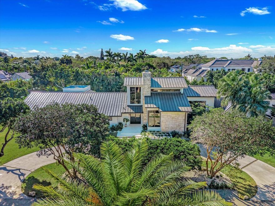 Welcome to Villa Armonia. Originally built in 1983 and completely renovated in 2025, this exceptional one-story residence offers 9,649 total sq ft and sits on a full acre within one of the few gated communities in North Pinecrest. This home is one of the latest turnkey residences designed and renovated by Sensi Casa Design. The property features six spacious bedrooms, each with its own en-suite bathroom and walk-in closet. Additional highlights include a dedicated playroom with dual TVs, a family room with bar, and two formal living areas—one featuring a fireplace—along with wood beam ceilings and an elegant blend of wood and stone flooring throughout. The residence also offers a gym, sauna, steam room, and a detached, air-conditioned three-car garage. Outdoor amenities include a heated pool, covered terrace, and BBQ area, ideal for year-round entertaining. The kitchen, bathrooms, and closets are Made in Italy by Mia Cucina, complemented by Miele appliances and premium finishes throughout the home. Offered fully furnished.