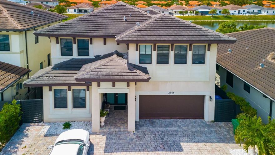 THIS STUNNING 5 BEDROOM  5 1/2 BATH HOME OFFERS OVER 3,700 SQ. FT. OF LUXURIOUS LIVING SPACE. MODERN ELEGANCE W/ AN OPEN-CONCEPT LAYOUT FEATURING CERAMIC TILE THOUGHOUT, ABUNDANT NATURAL LIGHT STREAMING THRU EVERY CORNER, OPEN KITCHEN W/ QUARTZ TOPS,  & A STYLISH ISLAND. LARGE BACKYARD WITH A GORGEOUS VIEW OF THE LAKE AND PERFECT TO BUILD YOUR DREAM POOL. LOCATED IN A GREAT SCHOOLS DISTRICT.  EXCELLENT LOCATION: CLOSE TO EXPRESSWAYS, SHOPPING CENTERS, HOSPITALS AND MUCH MORE. READY TO MOVE-IN