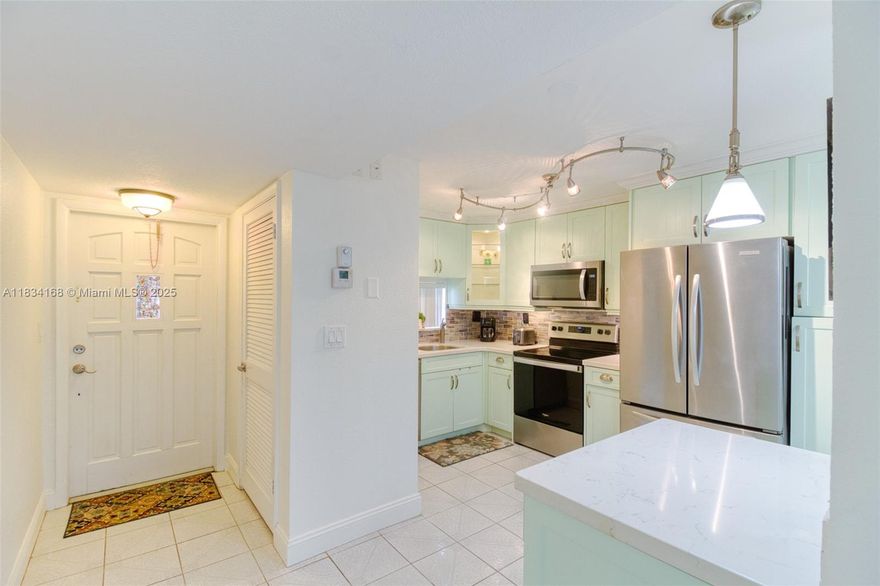Fantastic value for a renovated unit! Light and bright first-floor 2/2 condo in the active 55+ community of Hollybrook in Pembroke Pines. The home features a tastefully renovated kitchen w/ quartz countertops, stainless steel appliances, and lots of cabinet storage. The large dining/family room walks out to your private screened patio overlooking the golf course. Enjoy the in-unit washer/dryer hookup and tankless water heater. Association includes water, basic cable, internet, and full recreational access. Amenities: 2 golf courses (PGA & Par 3 – free, just pay for the cart), 7 heated pools, 14 tennis courts, pickleball, fitness center, theater, clubhouse, restaurant, and more. Pet-friendly (1 pet up to 20 lbs). Rec fees paid in full. Gated 24/7 security. Minutes from shopping/dining. Resort-style living at incredible value.