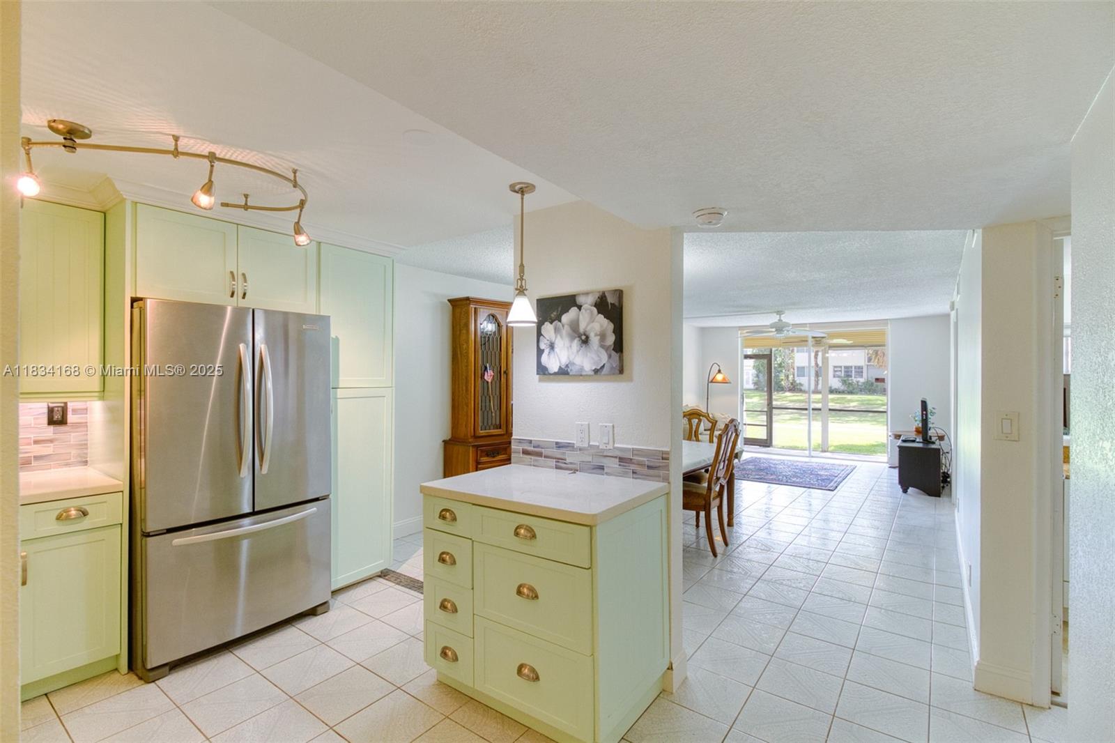 Light and bright first-floor 2/2 condo in the active 55+ community of Hollybrook in Pembroke Pines. The home features a tastefully renovated kitchen w/ quartz countertops, stainless steel appliances, and lots of cabinet storage. The large dining/family room walks out to your private screened patio overlooking the golf course. Enjoy the in-unit washer/dryer hookup and tankless water heater. Association includes water, basic cable, internet, and full recreational access. Amenities: 2 golf courses (PGA & Par 3 – free, just pay for the cart), 7 heated pools, 14 tennis courts, pickleball, fitness center, theater, clubhouse, restaurant, and more. Pet-friendly (1 pet up to 20 lbs). Rec fees paid in full. Gated 24/7 security. Minutes from shopping/dining. Resort-style living at incredible value.
