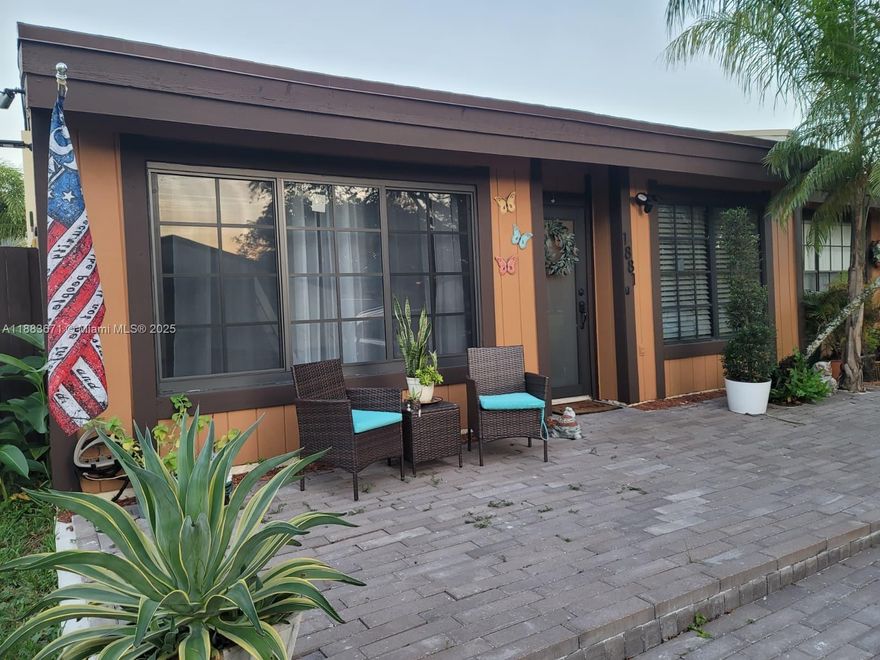 Remodeled corner townhome with new bathrooms, new roof, impact windows, and a recently installed A/C. Kitchen features a water filter system. Offering 2 bedrooms, 2 bathrooms, plus a den perfect for office or playroom. Enjoy canal views, a covered terrace, and private patio ideal for BBQs and family gatherings. Includes shed for tool lovers, 2 assigned parking spaces, and plenty of guest parking. Community offers a beautiful lake, ideal for afternoon walks and relaxation. Prime location near shops, dining, and main roads. Move-in ready!