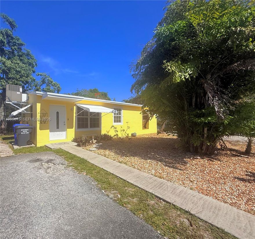 NEW ROOF IN THE WORKS: This Bright & Spacious 3/1 home is a little gem, ready to move in and add your personal touches.  New A/C 2022, Large Laundry room, Tile flooring throughout. New Appliances, 2 driveways, Ample parking for 4 cars. Large backyard, room for a pool. Fruit tree. Awesome Location, just minutes to Hard Rock, major highways, shopping, schools, fence around most of backyard
