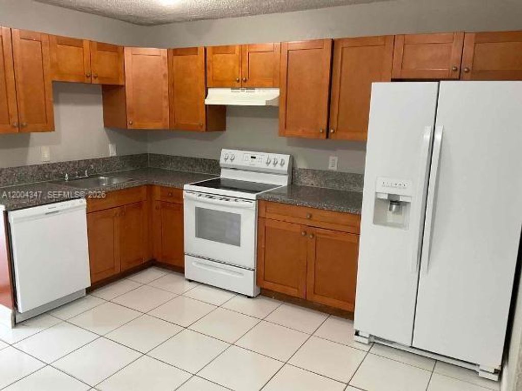 Photo of 1389 SW 24th Ave, Fort Lauderdale, FL 33312 (MLS # A12004347)