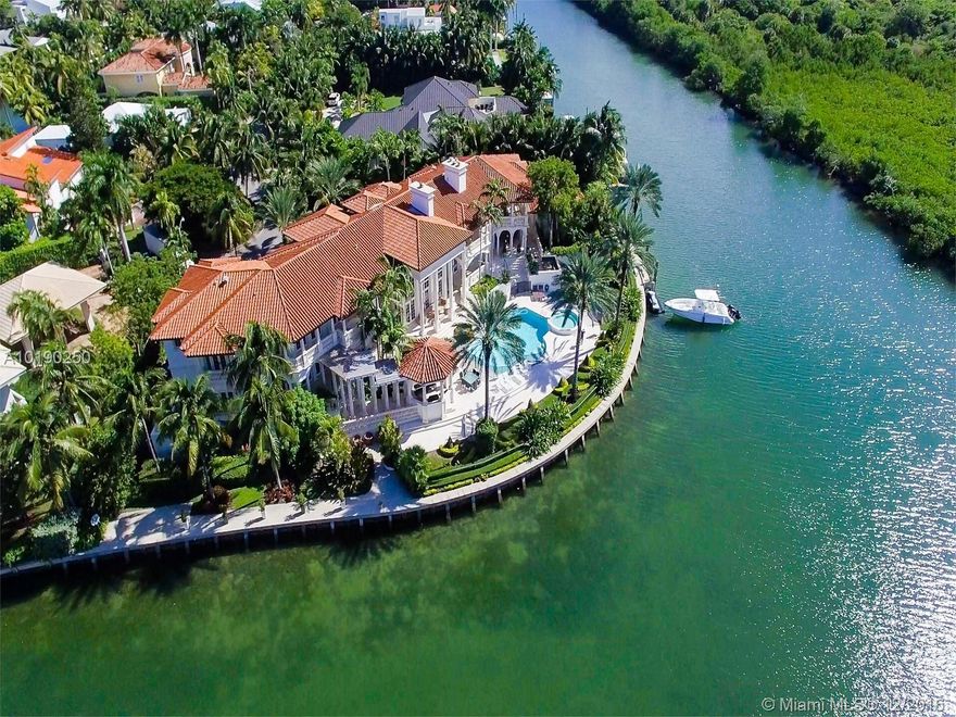Private and prestigious waterfront estate featuring panoramas of Miami's Biscayne Bay. This property is a haven for boating enthusiasts with 346 ft. of water frontage & direct ocean access. This gated estate is one of the island's largest, set on a lush 3/4 acre lot perfect for entertaining. Designed with the finest attention to detail, the home is extremely spacious (18K sf) including 9 BRs, library, office, theater, bar, gourmet kitchen, marble & Brazilian hardwood floors, security cameras, Lutron lighting & more.