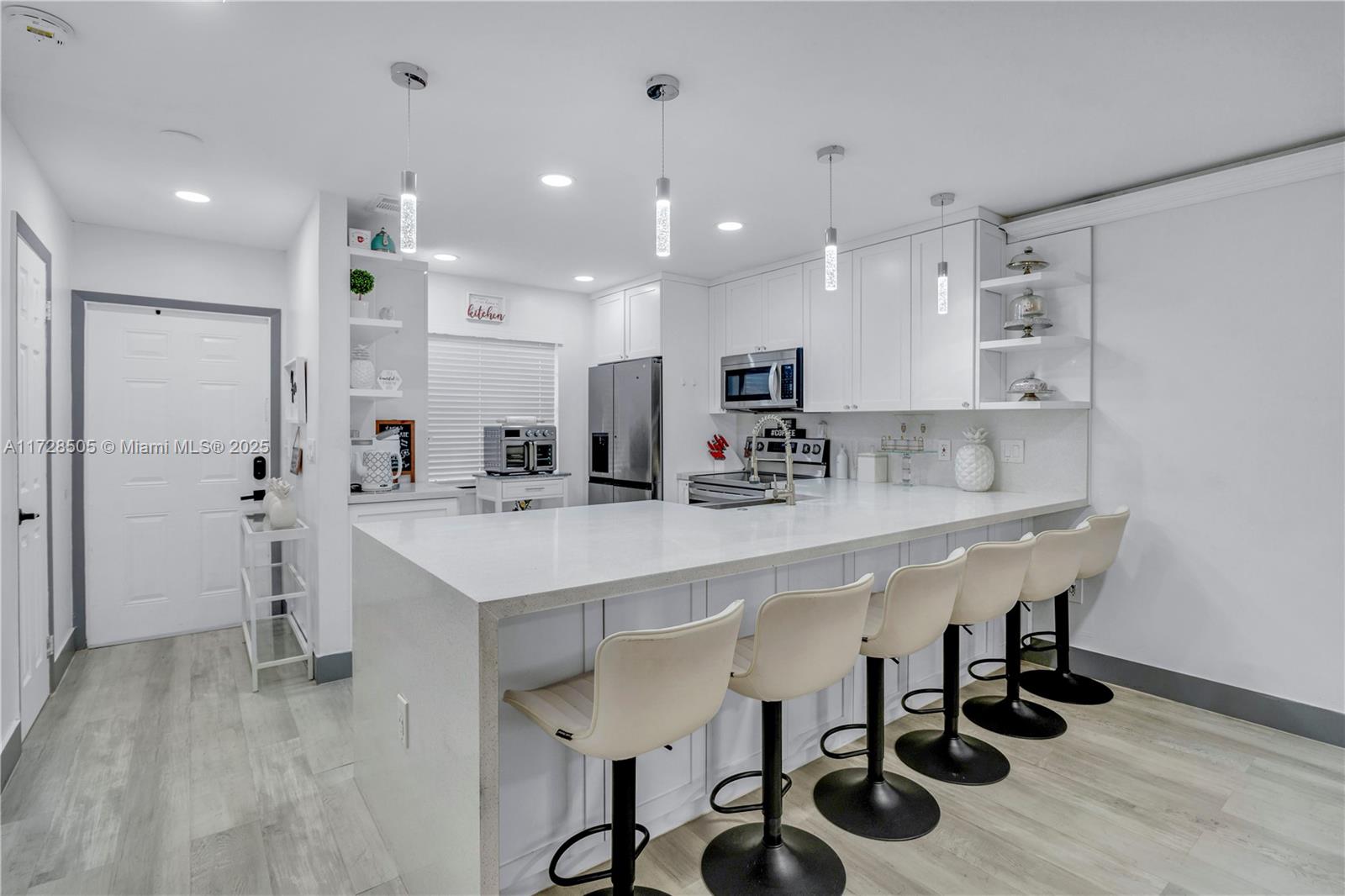 Located in the heart of Midtown Plantation, this charming townhouse offers convenience and serenity. Enjoy a vibrant, pedestrian-friendly community and a beautiful pool. This fully renovated 2-bed, 2.5-bath home features an open-concept kitchen with quartz countertops and a waterfall island. New stainless steel appliances, high-end laminate flooring, and modern lighting add elegance. Relax on the private, screened-in balcony overlooking a serene lake. Move-in ready with thoughtful updates, this home exemplifies pride of ownership. Don’t miss out on this perfect blend of privacy and convenience!
