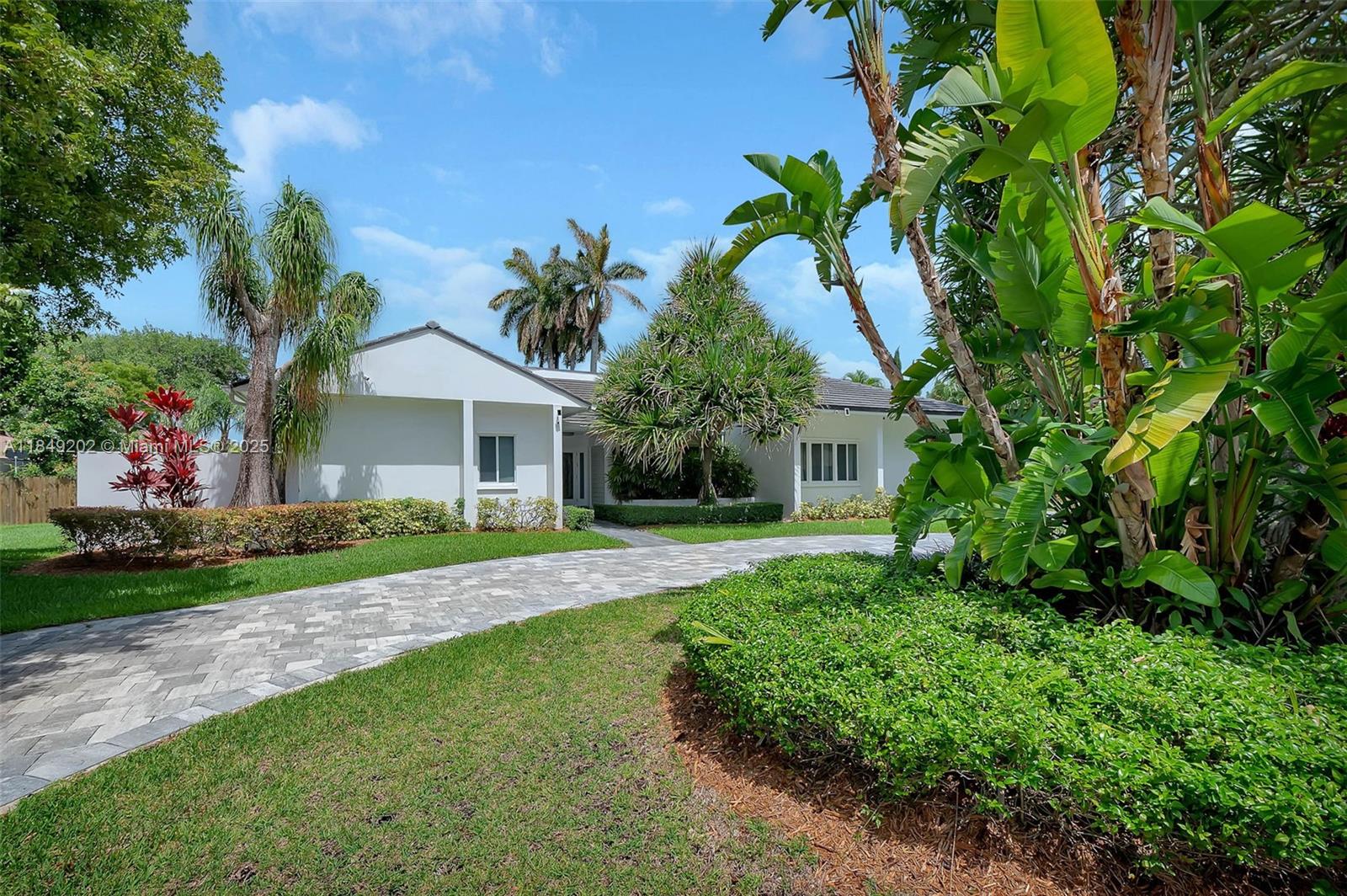 Fantastic 4-bdrm, 3-bath home on a quiet cul-de-sac in North Pinecrest. Formal living & dining rms provide the perfect entertainment space for your guests. Graceful, vaulted ceilings & neutral tile flooring. Delightful kitchen w/ newer appliances, espresso cabinetry & quartz countertops. Separate glass enclosed Florida rm, an ideal breakfast nook, overlooking the beautiful pool area, with family rm just beyond. 3-way split bdrm floor plan. Private & spacious primary suite features sitting area, or space for an office, 2 large walk-in closets, decadent bath w/ separate shower, jetted tub & dressing area. Plantation shutters. Indoor laundry rm. Newer tile roof. Picturesque, fenced backyard w/ pool, marble tile patio, covered terrace, shed. Paver circular driveway. 2-car side entry, garage.