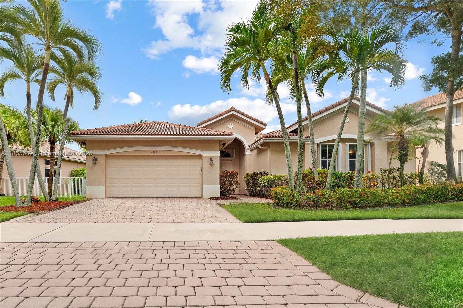 Renovated one-story in gated Savanna at Weston. 4 bedrooms, 2.5 baths, 2-car garage. Private pool with paver patio, covered sitting area, and a ficus-hedged, fully fenced yard. The kitchen was remodeled with a large island, granite counters, a pantry, and stainless steel appliances. Oversized diagonal stone tile flows through all living areas and bedrooms. Volume ceilings, foyer entry, French doors, crown molding, custom lighting, and an indoor laundry room. Spacious primary with walk-in closets, Roman tub, dual sinks, and separate shower. Full accordion shutter protection. Stroll over to Savanna’s community center with a heated lap pool and waterslide, and the clubhouse with a restaurant, tennis, pickleball, and more.
