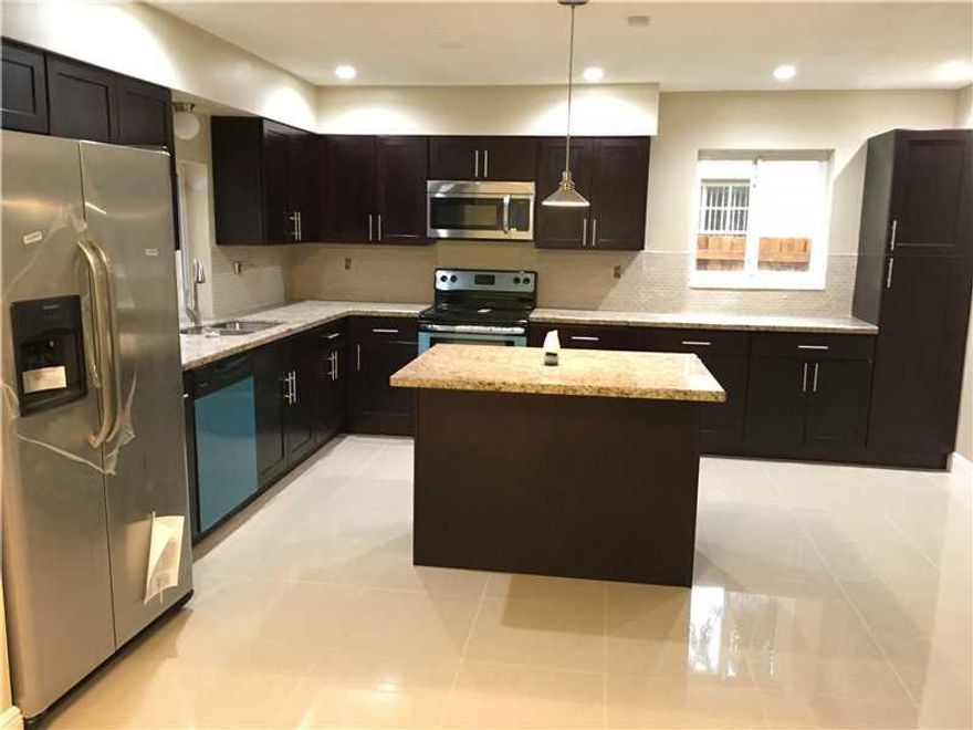 Beautiful 2/2 completely renovated house with garage converted to an office. New Tile Floors, Fresh Paint, Renovated Bathrooms, New A/C,New Kitchen with Granite, New Stainless Steel Appliances, Pool just redone with warranty, Hurricane Impact Windows and  garage Door, Roof replaced 5 years ago. Property is less than 3 miles to the beach. Reduced for quick sale! Submit all cash offers!