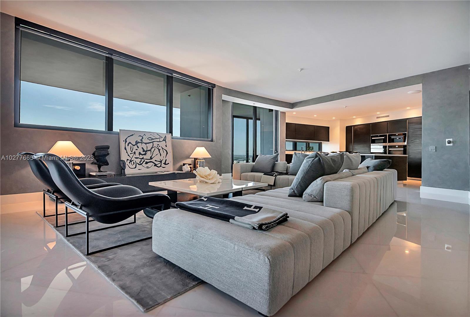 Located on the 35th floor the apartment boasts breathtaking panoramic views of the Intracoastal, City & Downtown Miami with absolute privacy from every room. Beautifully finished with oversized diamond white marble in the social areas, European graphite oak wood floors in the bedrooms, custom closets and electric window treatments. Also offered with Poggenpohl kitchen cabinets, Miele appliances and bathrooms; over-sized terrace with private pool & BBQ. Furniture for sale. Featuring a unique car elevator that lets you ride the car up to your sky home. Building amenities: concierge, ocean front & sunset pools, spa & fitness center, movie theater, restaurant, lounge bar, virtual golf & car racing simulators.