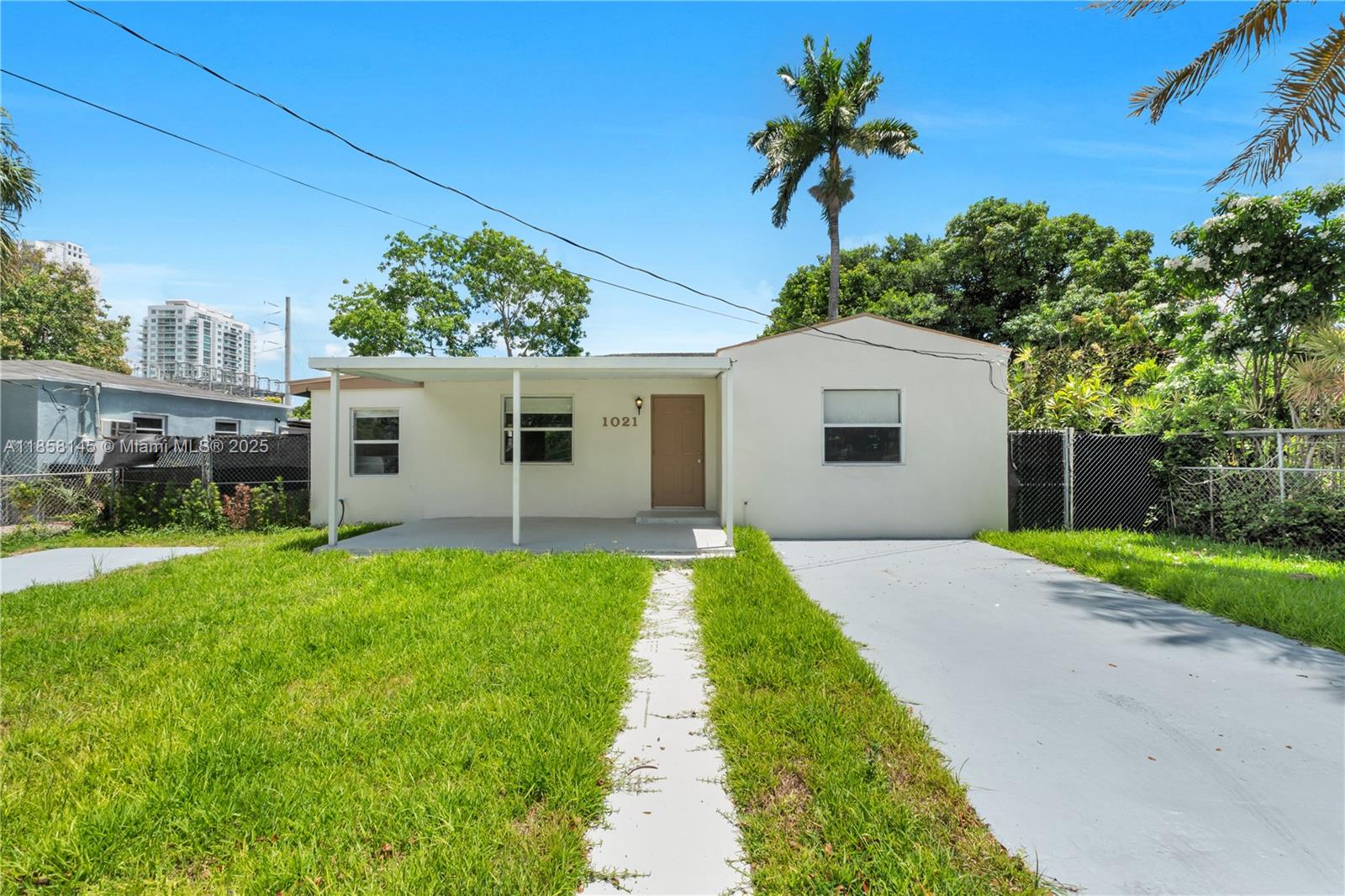 Charming renovated 3-bedroom, 2-bath single-family home in the desirable North Sewell Park/Nelsen Park area of Miami. Featuring a beautifully updated kitchen with granite countertops and wood cabinets, remodeled bathrooms (2025), a new 2024 Rheem air conditioner, a new 2024 tankless water heater, and a 2014 roof. Interior highlights include laminate flooring throughout, a spacious living/dining area, and a full laundry room. Enjoy an oversized fenced backyard with an L-shaped covered terrace ideal for outdoor dining, barbecues, and entertaining—plus a large covered front porch and two separate driveways. Conveniently located near Miami International Airport, Downtown, Brickell, I-95, and SR 836, with schools, shopping, and public transportation nearby. No HOA.