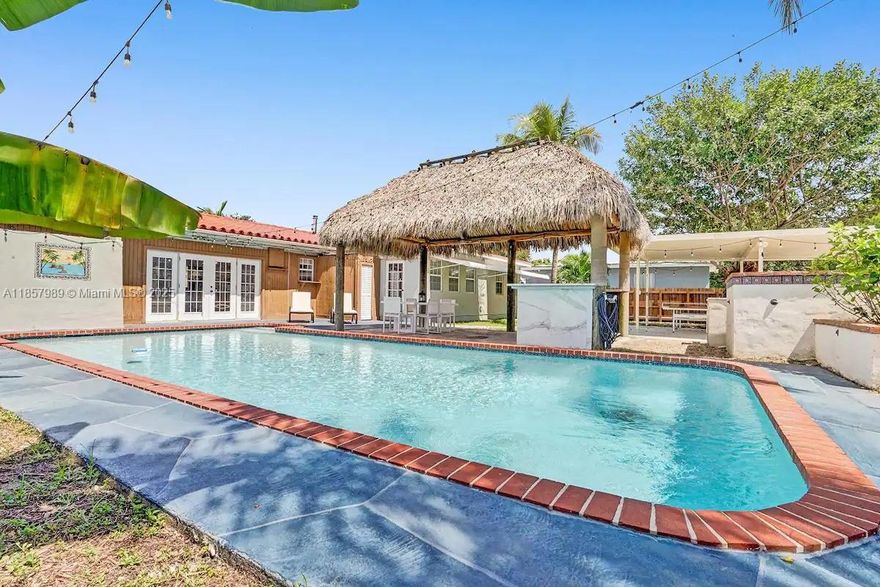 This modern, fully furnished single-family home boasts luxurious living with 4 bedrooms and 3 bathrooms, offering both comfort and style. Step into relaxation with a heated pool, perfect for year-round enjoyment. Entertainment takes center stage with a pool table inside and ping pong table outside. The outdoor oasis is a true highlight, featuring a Tiki Hut and an outdoor kitchen. Retreat to the master bedroom, where luxury awaits - the Jacuzzi tub or refresh in the double-size shower, creating a spa-like experience. With its seamless blend of modern design, entertainment options, and outdoor bliss, this property invites you to savor every moment in style and sophistication. Pets allowed upon owner's approval.