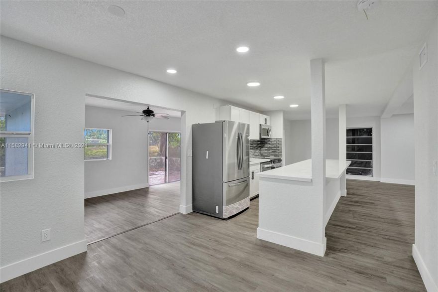 Back on the market! Financing fell through. Beautifully renovated 3/2 plus Florida room in the family friendly town of Tamarac. Large 10,000 square foot lot overlooking water and room for a pool. Association has no approval process and is only $140 per year. New roof, new bathrooms, kitchen, floors and an open layout.