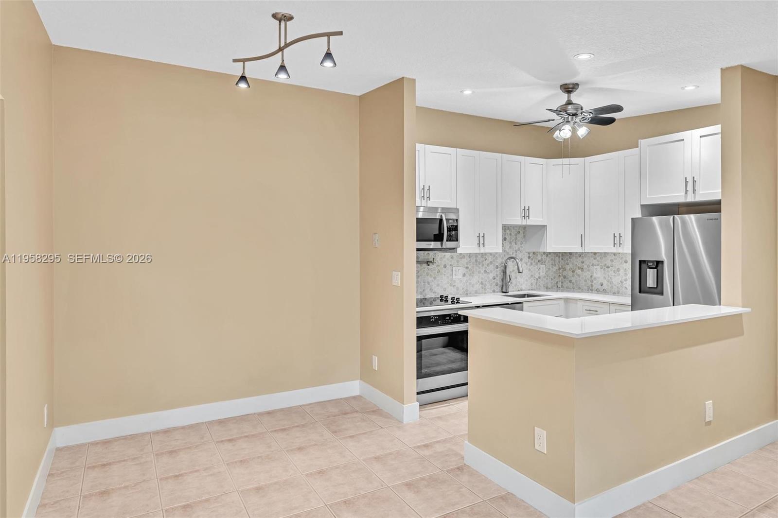 TAMARAC GARDENS CONDOMINI - Residential Lease