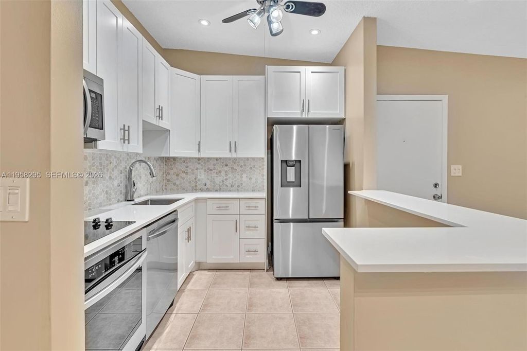 Photo of 9487 W Mcnab Rd #205, Tamarac, FL 33321 (MLS # A11958295)