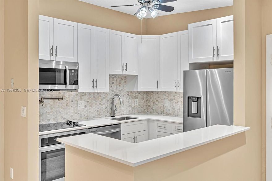 COMPLETELY REMODELED 2 bedroom 2 bathroom condo in Tamarac. Available April 1, 2026. Tenant Occupied. By Appointment Only. As you walk in you will be greeted with vaulted ceilings, recessed lighting, a brand new kitchen with quartz countertops and stainless steel appliances. You will notice new interior paint, 6 inch baseboards and tile throughout. The bathrooms offer new cabinets with quartz countertops, framed mirrors, rain shower heads and shower glass doors. Laundry room has newer smart Front Load Washer/ Dryer with a quartz countertop. Enjoy living in a residential community close to shopping, restaurants, sport and concerts venues, places of worship and easy access to major highways. Tamarac Gardens offers a community pool with a Clubhouse, tennis courts, outdoor shuffleboard courts, BBQ area with picnic tables, pond access and mature landscaping.