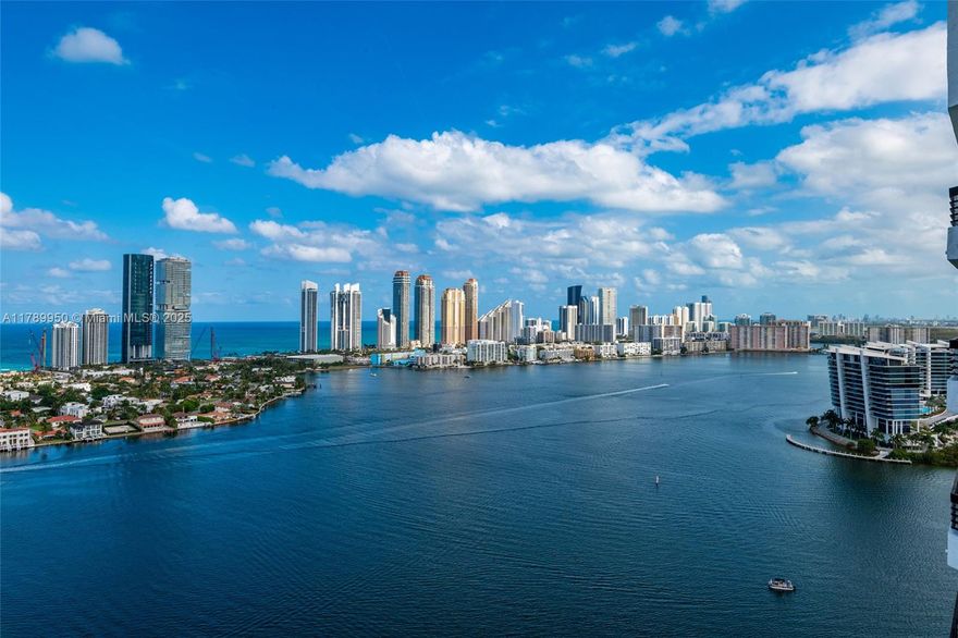 Spacious 2 bed, 2.5 bath lower penthouse with stunning intercoastal and ocean views. Features include a bright split floor plan, water-view kitchen, primary suite with walk-in closet, dual vanities, tub, and shower. Comes with covered parking. Located in Mystic Pointe, offering resort-style amenities like tennis courts, pool, gym, sauna, salon, market, and more.