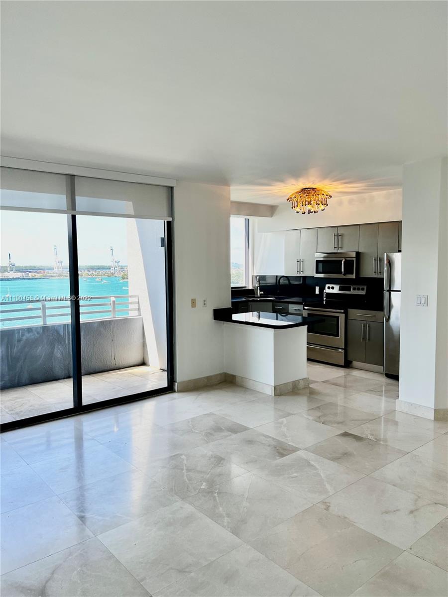 Waverly South Beach, water view, two bedroom, split plan with large balcony, gorgeous city and bay views. Beautiful marble floors throughout, upgraded kitchen and baths, full size washer and dryer. Best waterfront location,3 blocks from exciting Lincoln Road and easy walk to beach. Full service luxury building, heated lagoon style pool, Jacuzzi, sand volley, 24/7 front desk, security, valet, gym, BBQ, tennis. Premium cable, high speed Internet included in rent. One assigned parking space and valet.