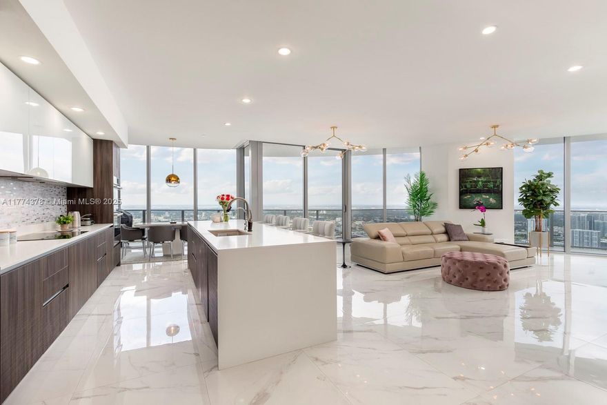 Great opportunity to rent this gorgeous 3-floor penthouse on the 51st floor at luxurious Aria on the Bay with both city and water views. Enjoy seamless entertaining in this 4 bed, 4.5 bath home with your own oversized private rooftop terrace with a jacuzzi. It doesn’t stop here, there's a beautiful, open chef’s kitchen equipped with Bosch appliances and Italian cabinetry. Additional features include 4 assigned parking spaces, floor to ceiling impact windows, and beautiful porcelain floors. You can live the luxury resort lifestyle with 3 floors of amenities including: sunrise+sunset pools, gym, yoga studio, theater, game room, spa, lounge, conference rooms, etc. Steps away from the Arts&Entertainment District, minutes from Midtown and the centers of Downtown+Brickell.