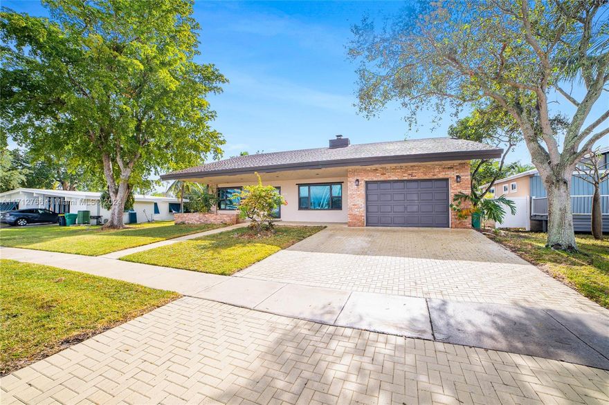 Highlights: The Driveway is Newly completed in 2023, Garage was Upgraded into an air-conditioned man cave with a pool table. Living Room has Hardwood floors, built-in surround sound & cozy fireplace. Kitchen Updated with wood cabinets, quartz countertops, new flooring. Washer/dryer(2022), water heater(2021), AC unit(2019). Bedrooms & Bathrooms: 3 bedrooms, 2 full bathrooms(renovated in 2020), plus a converted playroom as a 4th bedroom. Garage Utilities: Water heater for bedrooms and AC installed in 2019. Windows & Doors: Impact-resistant windows and doors(2018). Pool: Renovated in 2023 with Diamond Brite finish, saltwater system. Soft Rainwater System: Installed by the pool. New landscaping completed in 2022. Location is Across from the marina & minutes to Dania Beach.