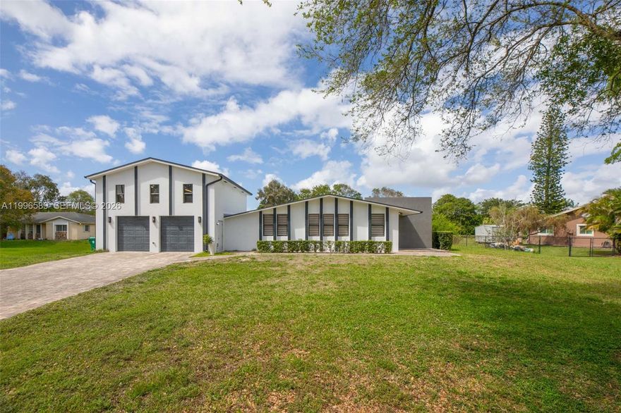 Hard to find and highly sought after, this Southwest Ranches rental is perfect for tenants who need serious garage and storage space. Whether you have multiple vehicles, a work truck, toys, or need a functional workshop, this property truly stands out. The oversized garage is a major highlight, offering generous space for cars, trucks, trailers, equipment, or hobby use, along with easy access and additional on-site parking. Perfect for contractors, car collectors, small business owners, or anyone who values usable space without HOA restrictions. This completely updated 3-bedroom, 2-bathroom home with a large office features modern finishes throughout, including upgraded flooring, a refreshed kitchen, and renovated bathrooms. The bright, open layout offers comfortable living and flexibility for working from home. The primary suite provides a private retreat, while the large office can serve as a fourth bedroom or workspace. Situated on an expansive lot, the property offers privacy, versatility, and plenty of room to spread out. Located in a quiet acreage community with easy access to highways, shopping, and dining.  Plenty of room for RV or boat parking, with wide driveway access and outdoor space ideal for entertaining or relaxing in a peaceful setting. Rentals like this are rare—schedule your showing today.