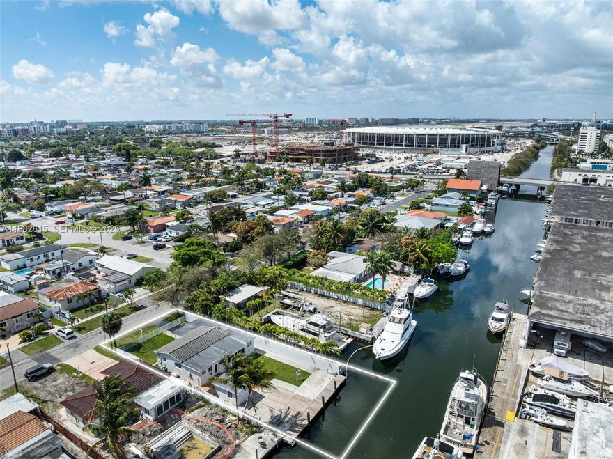 Need a place to dock your 60-ft yacht in deep water just minutes from Miami International Airport—and enjoy a stylish pied-à-terre? This Miami River offering delivers it all! Located near Miami Freedom Park in Grapeland Heights, home to the new Soccer Stadium! Beautifully remodeled w/wood & porcelain floors,new kitchen & baths,and a split layout: 3BR/2BA on one wing and a private 1BR/1BA on the other. The family room impresses w/vaulted tongue-and-groove wood ceilings and canal views. Boaters will appreciate the private backyard slip on the Miami River,complete with water and electric at the dock. A detached storage shed for gear and equipment; completely fenced yard. Major upgrades: reinforced seawall (2018), roof & impact doors and windows (2020). Seller financing may be an option.