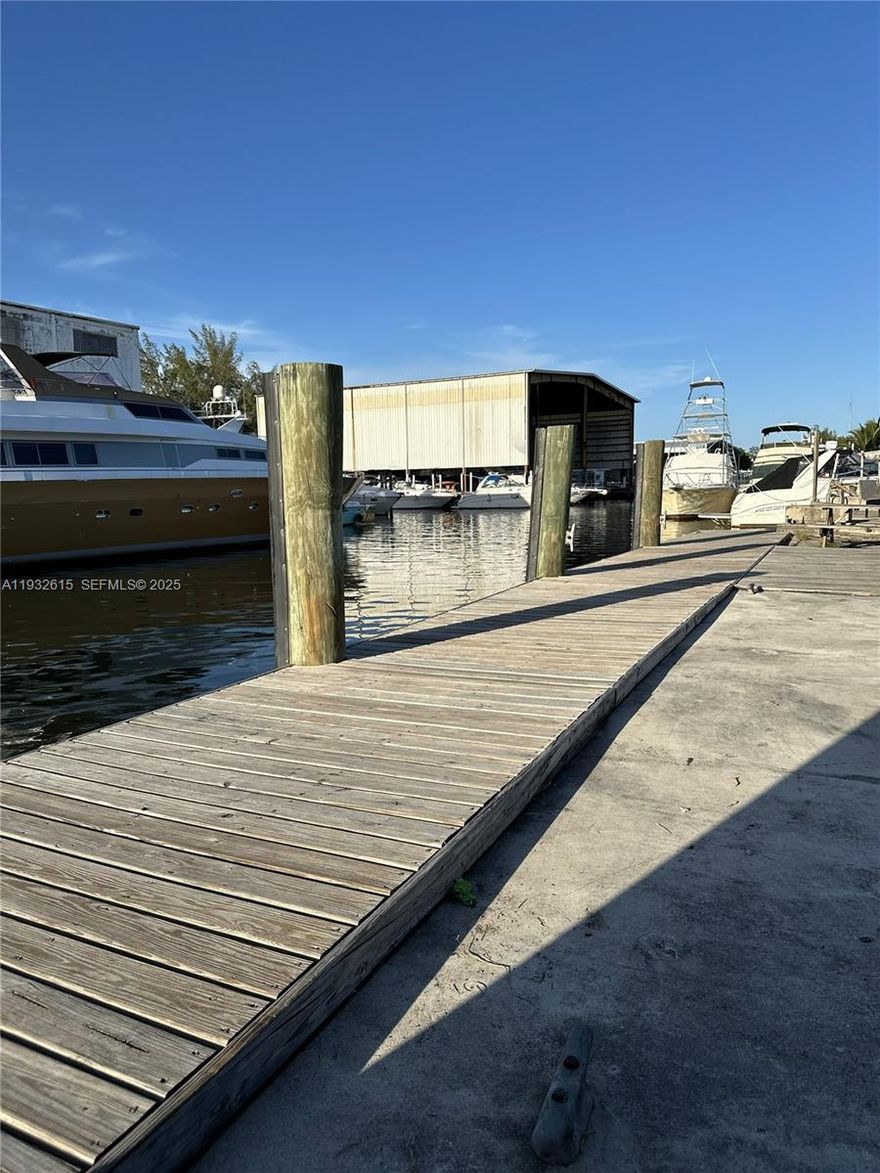 Need a place to dock your 60-ft yacht in deep water just minutes from Miami International Airport—and enjoy a stylish pied-à-terre? This Miami River offering delivers it all! Located near Miami Freedom Park in Grapeland Heights, home to the new Soccer Stadium! Beautifully remodeled w/wood & porcelain floors,new kitchen & baths,and a split layout: 3BR/2BA on one wing and a private 1BR/1BA on the other. The family room impresses w/vaulted tongue-and-groove wood ceilings and canal views. Boaters will appreciate the private backyard slip on the Miami River,complete with water and electric at the dock. A detached storage shed for gear and equipment; completely fenced yard. Major upgrades: reinforced seawall (2018), roof & impact doors and windows (2020). Seller financing may be an option.