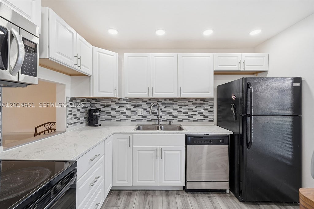 Photo of 5860 NW 64th Ave #102, Tamarac, FL 33319 (MLS # A12024651)