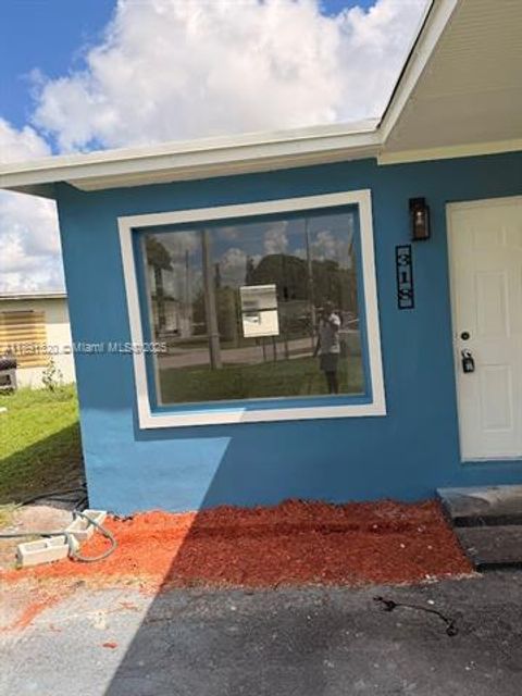 Photo of 318 NW 30th Ave, Fort Lauderdale, FL 33311 (MLS # A11891320)