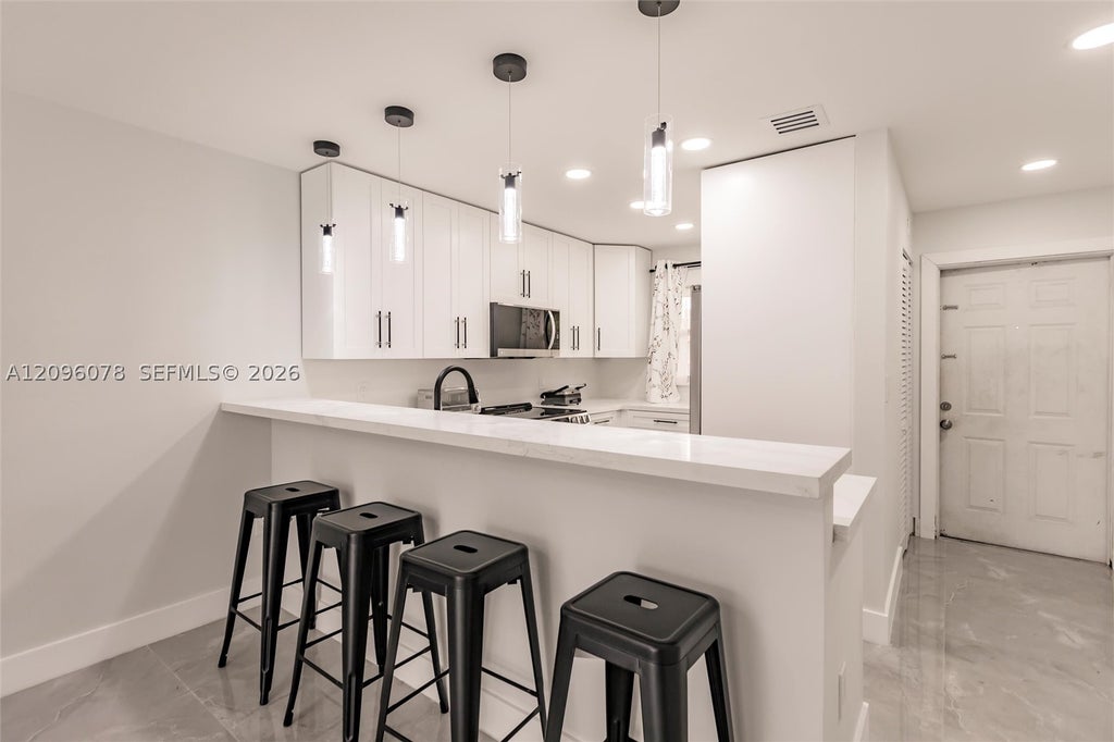 Photo of 807 W Oakland Park Blvd #H12, Oakland Park, FL 33311 (MLS # A12096078)