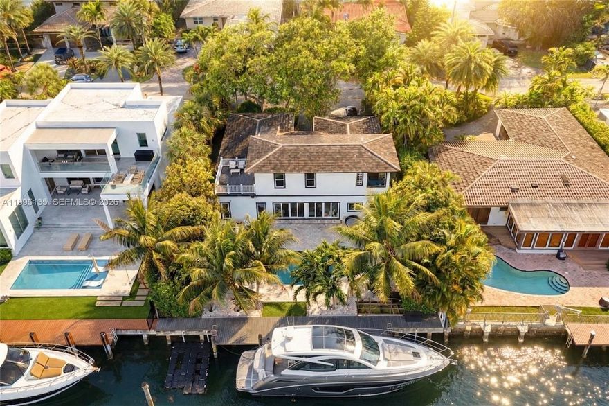 Nestled in the prestigious guard-gated community of Sans Souci Estates, this modern and two-story waterfront residence offers direct ocean access with no fixed bridges, an exceptional opportunity for boating enthusiasts.

This elegant home features 5 bedrooms and 4 bathrooms, including two spacious primary suites thoughtfully positioned on each level for ultimate flexibility and comfort. The interiors are finished with high-end black porcelain plank flooring and a sleek Mia Cucina kitchen, blending modern design with everyday functionality.

Expansive impact windows and doors fill the home with natural light while ensuring peace of mind. Recent upgrades include a 2017 roof, 2019 dock, and a recent sea wall. The 3-zone A/C system, offers efficiency.

Outdoor living is designed for both relaxation and entertaining, with a beautifully landscaped setting, a large natural stone patio, and a saltwater pool overlooking the water, perfect for enjoying Miami’s year-round sunshine. The private dock provides effortless access to the bay and ocean within minutes, ideal for seamless day-to-day boating.

Ideally located just moments from Bal Harbour, beaches, fine dining, and luxury shopping, with convenient access to major highways.

A rare turnkey waterfront property in one of Miami’s most desirable gated communities, offering privacy, security, and the ultimate South Florida lifestyle.